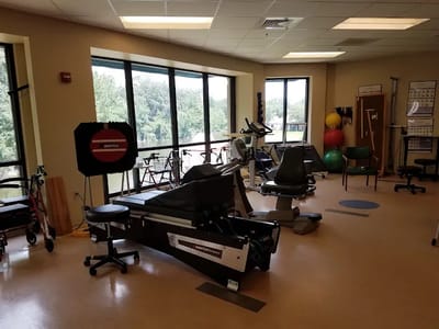 Interior view of a therapy room with exercise equipment