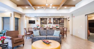 Bright common area with seating and dining space