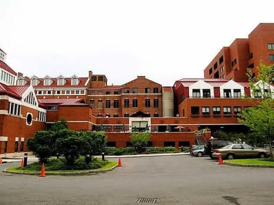 Exterior view of a red brick assisted living facility