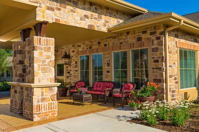 Outdoor seating area with colorful flowers and decorations