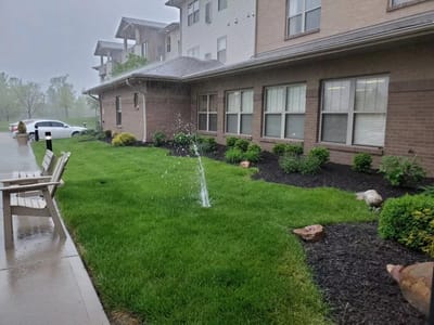 Green lawn with sprinkler system in a residential area