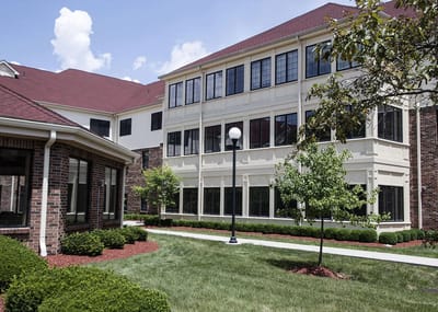 Exterior view of the building with landscaped grounds