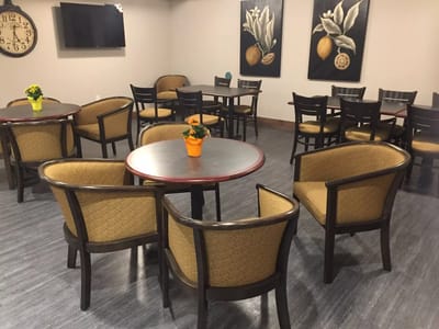 Common area with seating and decorative wall art
