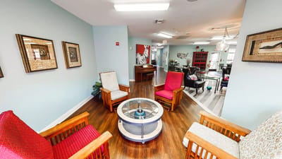 Cozy common area with seating and piano