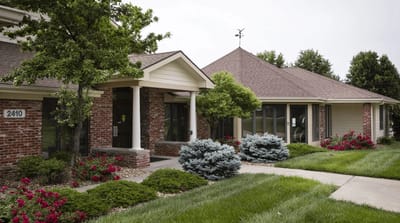 Exterior view of Rolling Hills Retirement Community with landscaped gardens