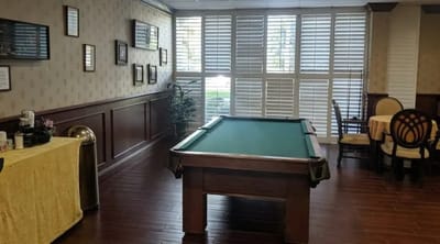 Common area with a pool table and seating