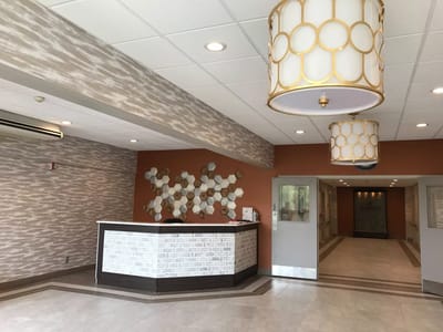 Bright lobby area with modern decor and reception desk