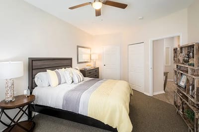 A well-furnished private resident room with bed and decor