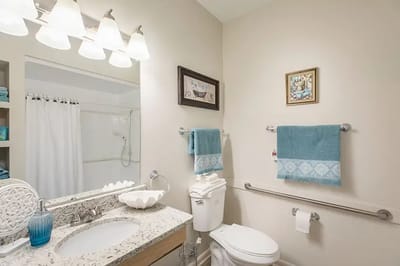 Brightly designed bathroom with turquoise accents