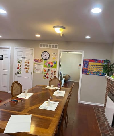 Dining room setup with a large wooden table