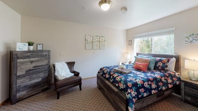 Cozy private room with floral bedding and natural light