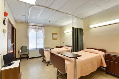 Interior view of a shared resident room with beds