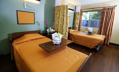 Interior view of a shared resident room with two beds