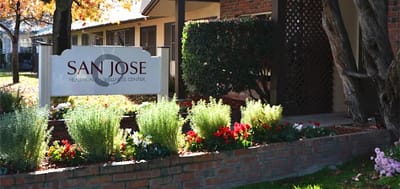 Exterior view of San Jose Healthcare & Wellness Center with flowers