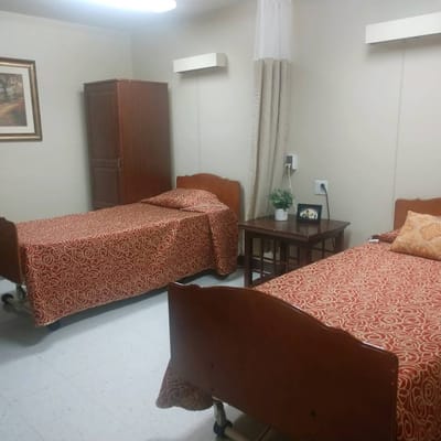 Interior of a shared resident room with two beds