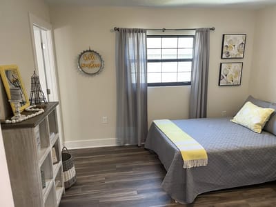 Cozy resident room with bedding and decor