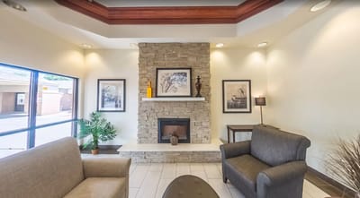 Cozy lobby area with seating and fireplace