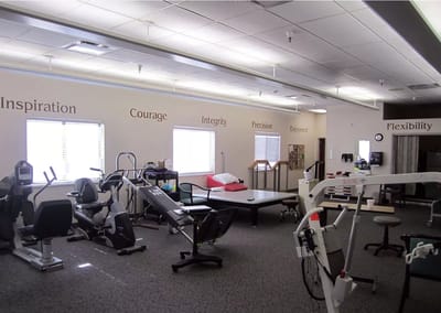 Interior of a therapy room with equipment and motivational words