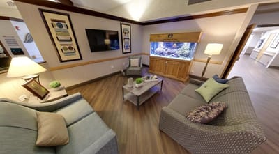 Comfortable common area with seating and aquarium