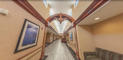 Well-lit hallway with decorative elements and seating