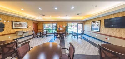 Bright common area with seating and windows