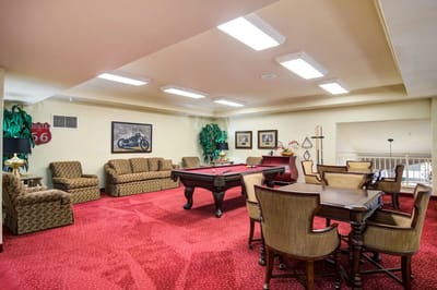 Bright common area with seating and a pool table