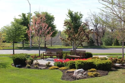 Beautiful outdoor seating area with flowers and trees