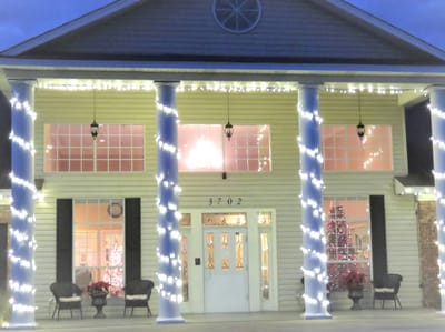 Exterior of the facility decorated with holiday lights