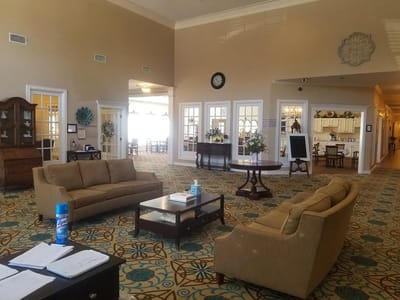 Bright interior common area with couches and decor