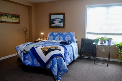 Cozy private room with bed and decor