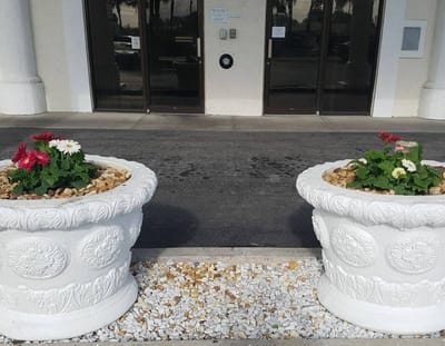 Flower pots at the entrance of a senior living facility