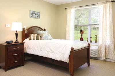 Cozy private bedroom in a senior living facility