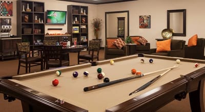Interior common area with a pool table and seating