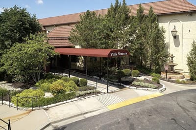 Exterior view of Villa Ventura entrance with landscaped area