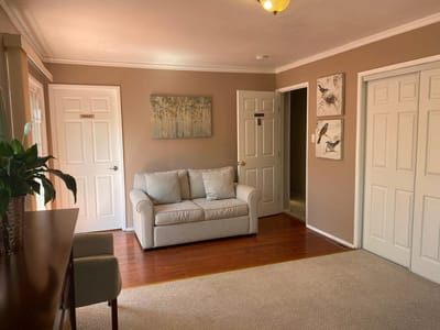 Bright common area with seating and artwork