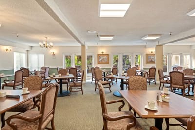 Bright dining area with tables and chairs
