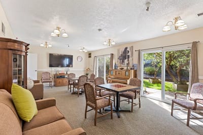 Bright common area with furniture and outdoor view