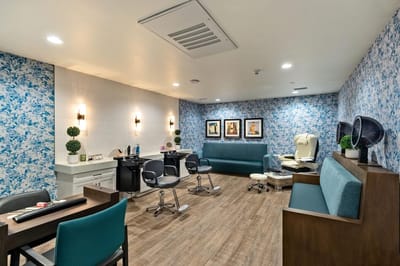 Interior of a beauty salon area with seating and decor