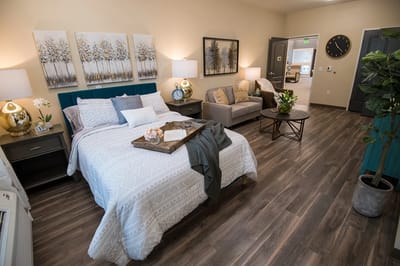Cozy resident room with bed and seating area