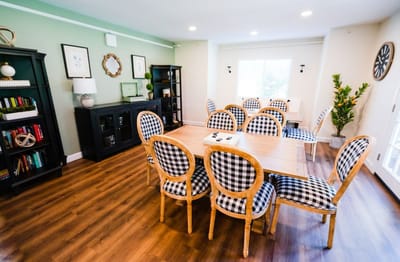 Bright common area with tables and chairs for socializing