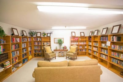 Interior view of a library-like common area with shelves