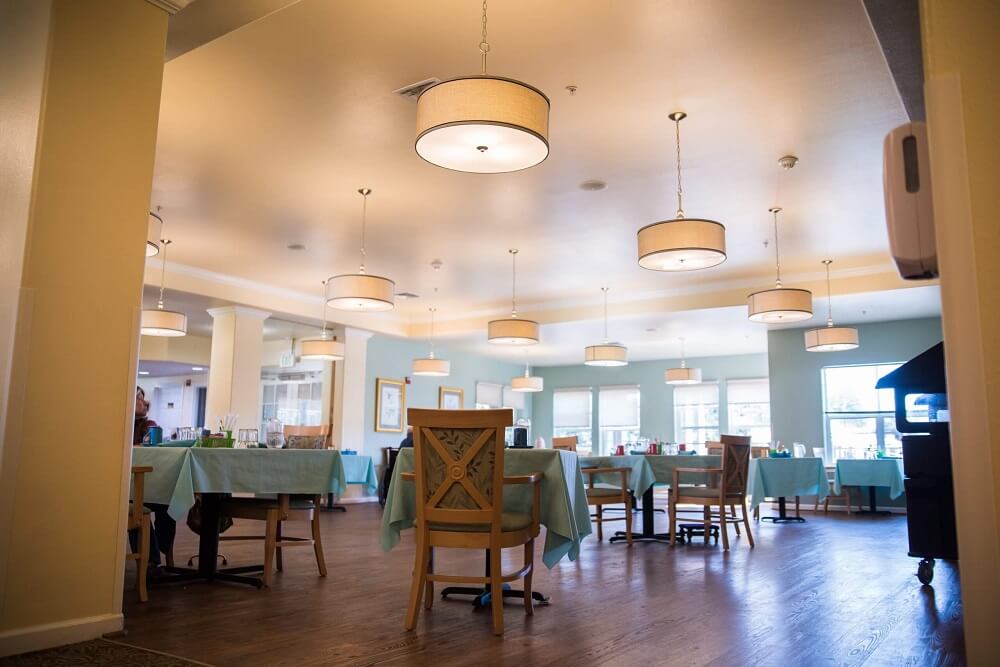 Dining area with tables and lighting fixtures