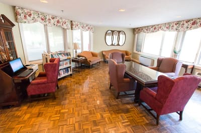 Interior common area with seating and a library