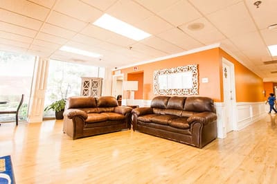 Cozy common area with brown leather sofas