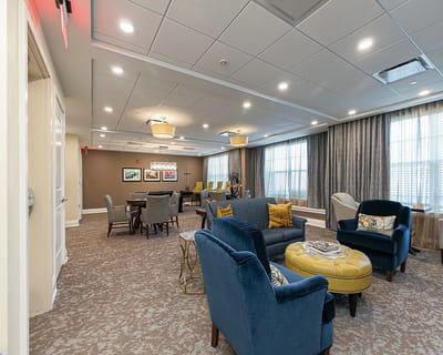 Bright common area with comfortable seating and artwork