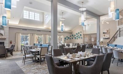 Bright dining room with tables set for a meal