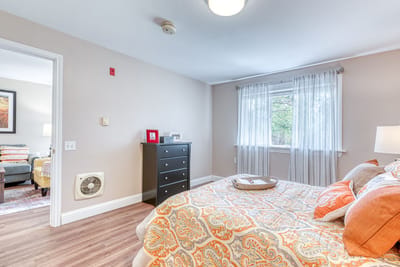 A well-decorated bedroom in a senior living facility