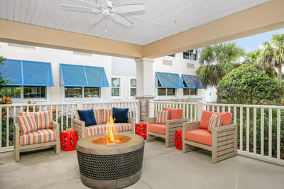 Outdoor seating area with fire pit and comfortable furniture
