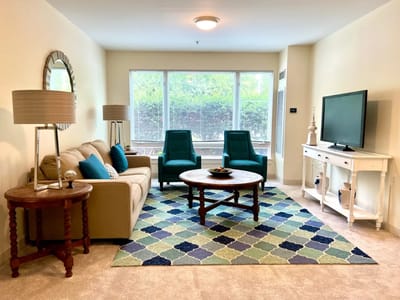 Cozy living room area with comfortable seating and natural light
