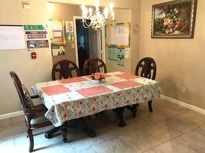 Dining area with a large table and decorative elements